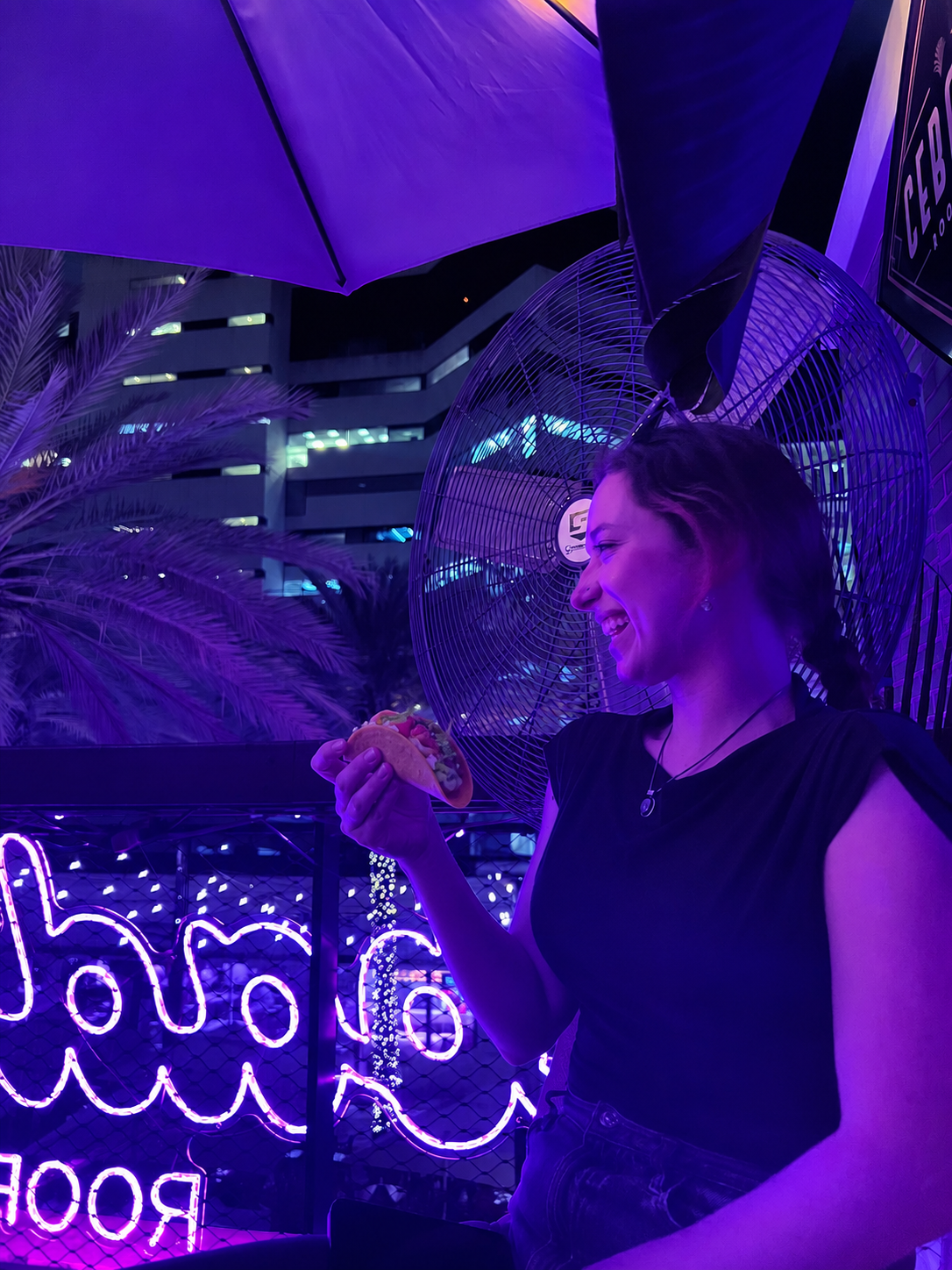 A teammate at a rooftop team night in Miami