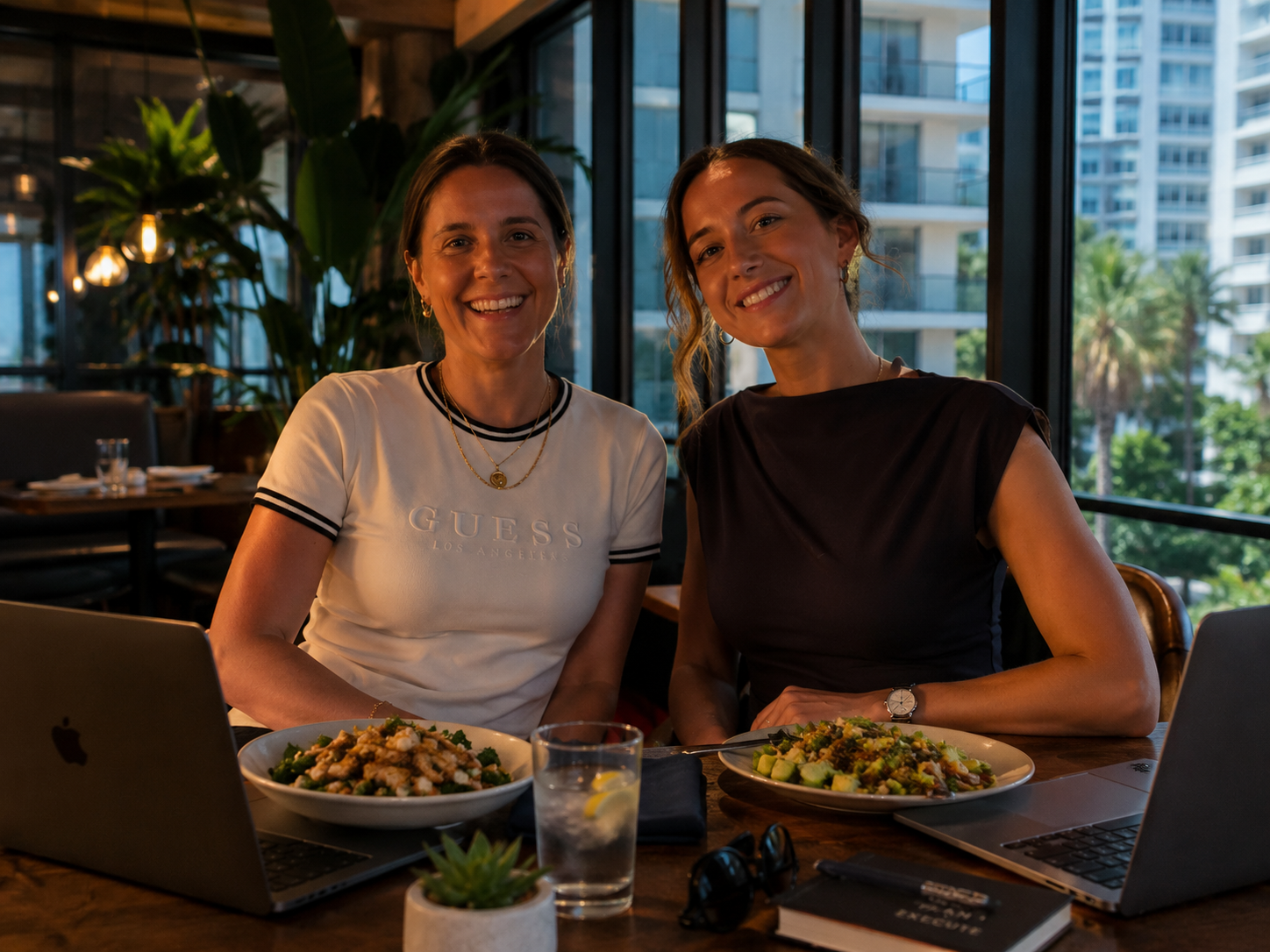 Two teammates working over lunch