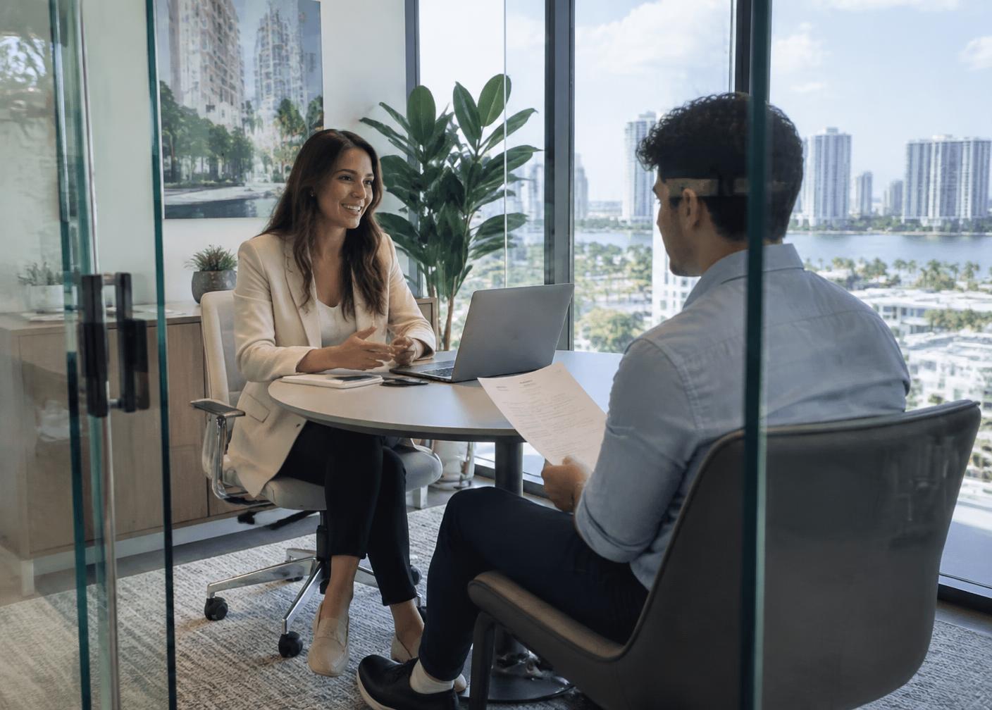 ATLAS. Consulting recruiter interviewing a candidate in the Miami office
